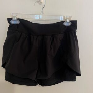 Lululemon black running shorts with built in spandex.